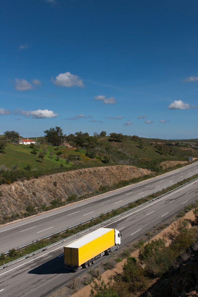 view of motorway with yellow truck